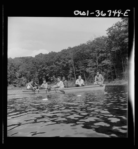 Southfields, New York. Interracial activities at Camp Nathan Hale, where children are aided by the Methodist Camp Service. Boating on the lake