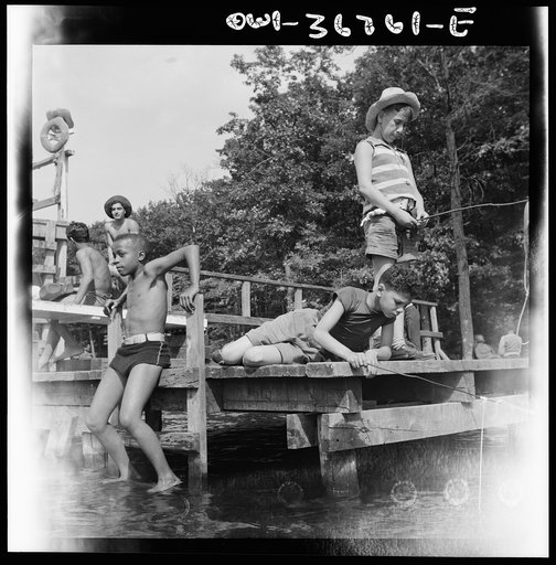 Untitled photo, possibly related to: Southfields, New York. Interracial activities at Camp Nathan Hale, where children are aided by the Methodist Camp Service. Fishing is one of the popular activities