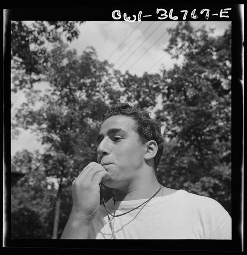 Untitled photo, possibly related to: Southfields, New York. Interracial activities at Camp Nathan Hale, where children are aided by the Methodist Camp Service. The town crier, Danny Poocchiari