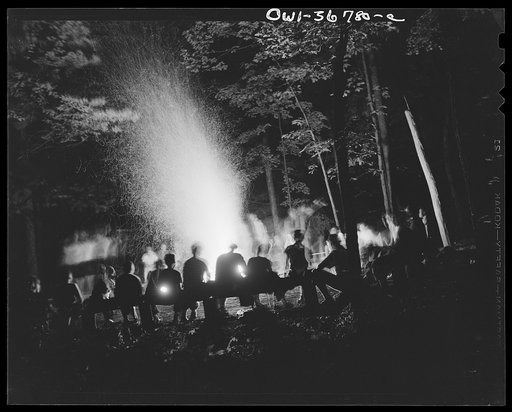 Untitled photo, possibly related to: Southfields, New York. Interracial activities at camp Nathan Hale, where children are aided by the Methodist Camp Service. Campers of the Methodist Camp Service and other organizations singing around the camp fire