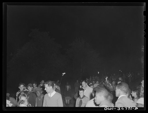 Tusten, New York. Interracial activities at Camp Brooklyn, where children are aided by the Methodist Camp Service. Boy Scouts leaving the campfire