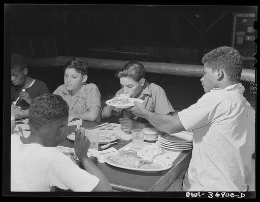 Southfields, New York. Interracial activities at Camp Nathan Hale, where children are aided by the Methodist Camp service. Pass along the food