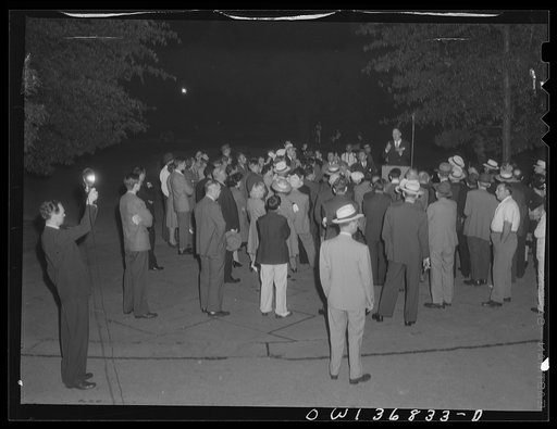 Untitled photo, possibly related to: Washington, D. C. Director of the USO (United Service Organizations) addressing a Catholic Evidence Guild rally in Franklin Park