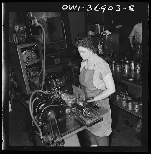 Pittsburgh, Pennsylvania. One of the women employees in the machine shop of the Greyhound garage working on a cylinder grinding machine