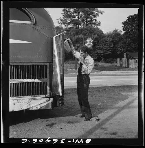 Untitled photo, possibly related to: A Greyhound bus that has been stopped while the driver fills the water tank at a gas station on the road between Gettysburg and Pennsylvania