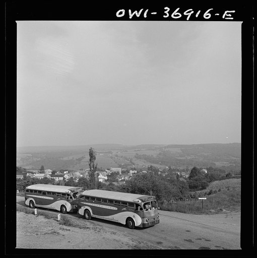 Two Greyhound buses going from Washington, D.C. to Pittsburgh, Pennsylvania