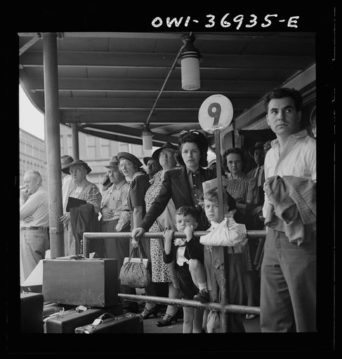Pittsburgh, Pennsylvania. Passengers waiting for a bus to pull up to the loading platform at the Greyhound bus terminal