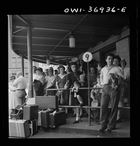 Untitled photo, possibly related to: Pittsburgh, Pennsylvania. Passengers waiting for a bus to pull up to the loading platform at the Greyhound bus terminal