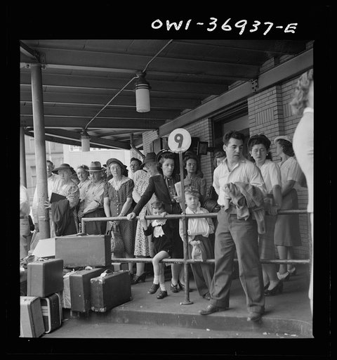 Untitled photo, possibly related to: Pittsburgh, Pennsylvania. Passengers waiting for a bus to pull up to the loading platform at the Greyhound bus terminal