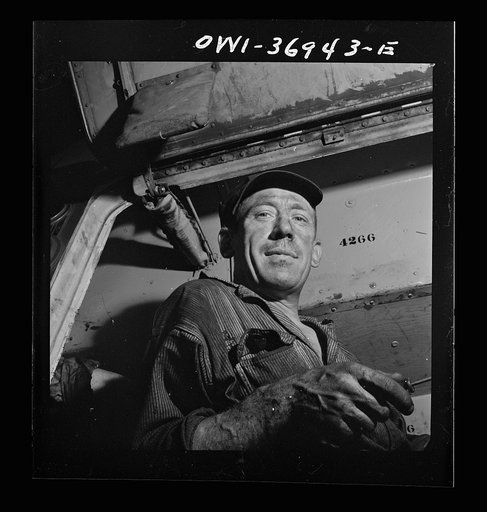 Pittsburgh, Pennsylvania. A mechanic at the Greyhound garage