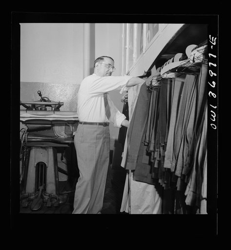 Untitled photo, possibly related to: Pittsburgh, Pennsylvania. Isidore Rubinoff, tailor at the shop in the Greyhound garage. He was the first tailor with the company, which now has five in various cities