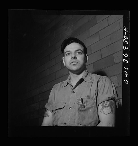 Pittsburgh, Pennsylvania. A mechanic at the Greyhound garage
