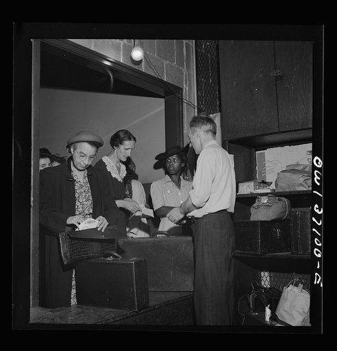 Pittsburgh, Pennsylvania. Passengers checking their bags at the Greyhound bus terminal