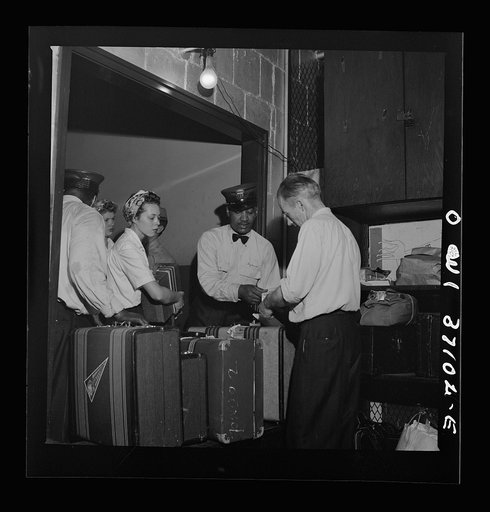 Untitled photo, possibly related to: Pittsburgh, Pennsylvania. Passengers checking their bags at the Greyhound bus terminal