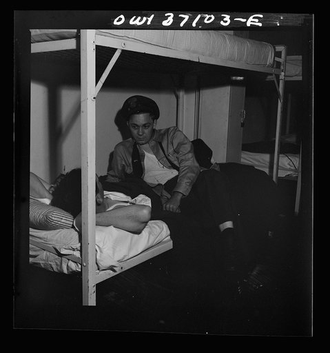 Untitled photo, possibly related to: Pittsburgh, Pennsylvania. A Greyhound bus driver dressing in dormitory at the garage. This is for the use of drivers living in another town but having their layover time in Pittsburgh