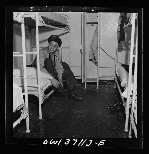 Pittsburgh, Pennsylvania. A Greyhound bus driver dressing in dormitory at the garage. This is for the use of drivers living in another town but having their layover time in Pittsburgh