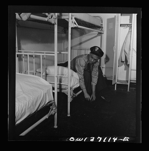 Untitled photo, possibly related to: Pittsburgh, Pennsylvania. A Greyhound bus driver dressing in dormitory at the garage. This is for the use of drivers living in another town but having their layover time in Pittsburgh