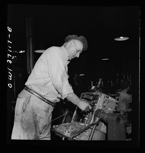 Untitled photo, possibly related to: Pittsburgh, Pennsylvania. A mechanic in the machine shop at the Greyhound garage