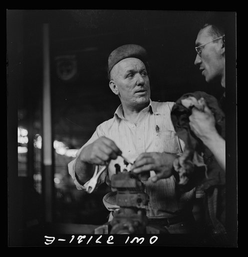 Pittsburgh, Pennsylvania. A mechanic in the machine shop at the Greyhound garage