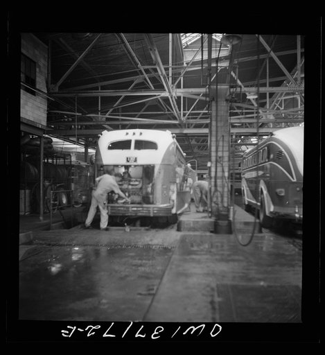 Untitled photo, possibly related to: Pittsburgh, Pennsylvania. Some Greyhound buses which are placed over pits for repairs at the garage