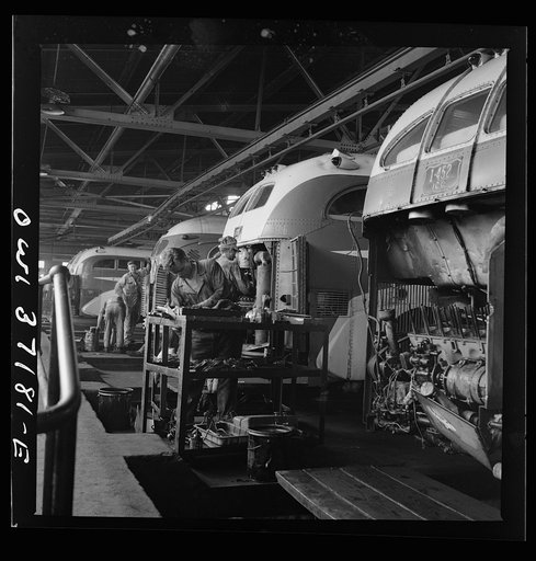 Pittsburgh, Pennsylvania. Some Greyhound buses which are placed over pits for repairs at the garage