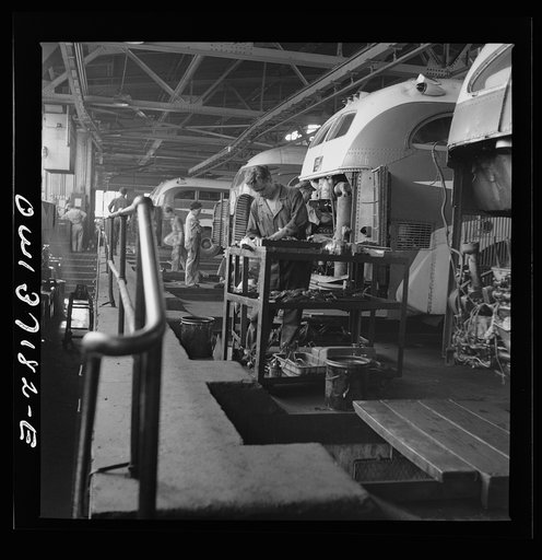 Pittsburgh, Pennsylvania. Some Greyhound buses which are placed over the pits for repairs at the garage