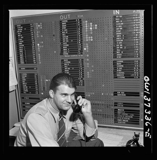 Pittsburgh, Pennsylvania. Dispatcher at the Greyhound garage. The board in the background shows drivers and equipment assigned to Pittsburgh and their whereabouts at a glance