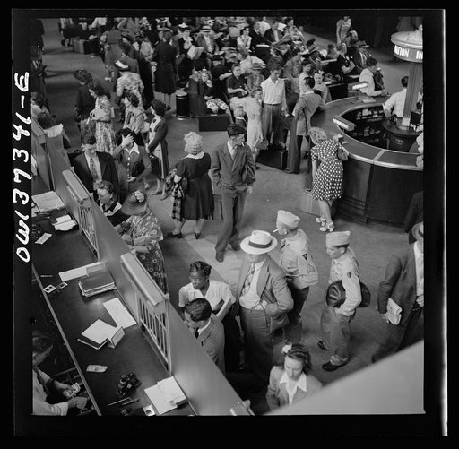 Pittsburgh, Pennsylvania. People buying tickets at the Greyhound bus terminal
