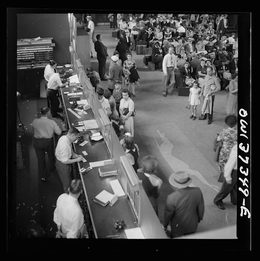 Pittsburgh, Pennsylvania. People buying tickets at the Greyhound bus terminal