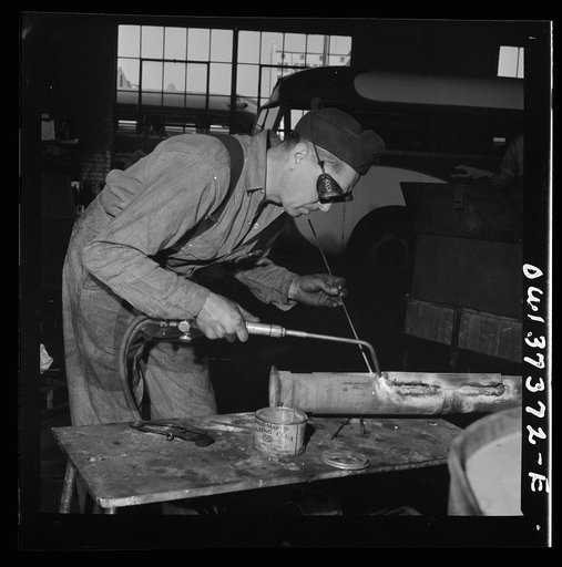 Columbus, Ohio. Fixing a bus part at the Greyhound garage