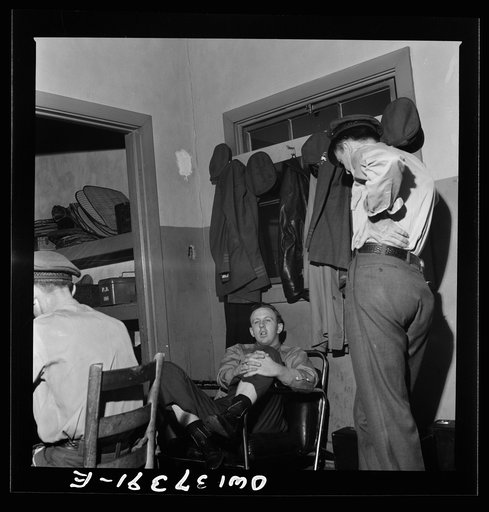 Untitled photo, possibly related to: Columbus, Ohio. Greyhound bus drivers resting in the drivers' room