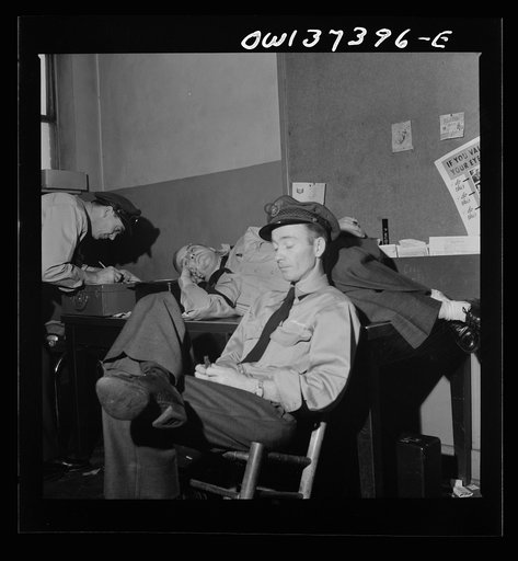Untitled photo, possibly related to: Columbus, Ohio. Greyhound bus drivers resting in the drivers' room