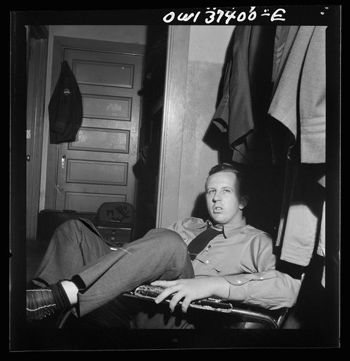 Columbus, Ohio. Clem Carson, a Greyhound bus driver, waiting for an assignment in the drivers' room