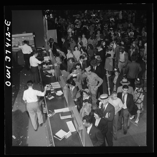 Pittsburgh, Pennsylvania. A crowd buying tickets at the Greyhound bus terminal