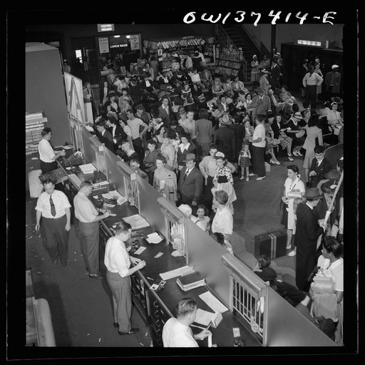 Pittsburgh, Pennsylvania. A crowd buying tickets at the Greyhound bus terminal