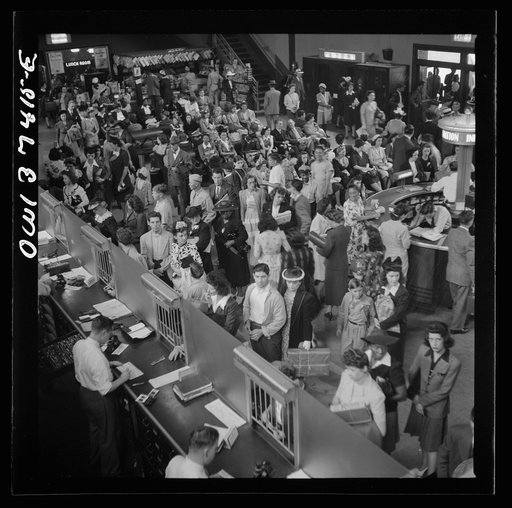 Pittsburgh, Pennsylvania. A crowd buying tickets at the Greyhound bus terminal