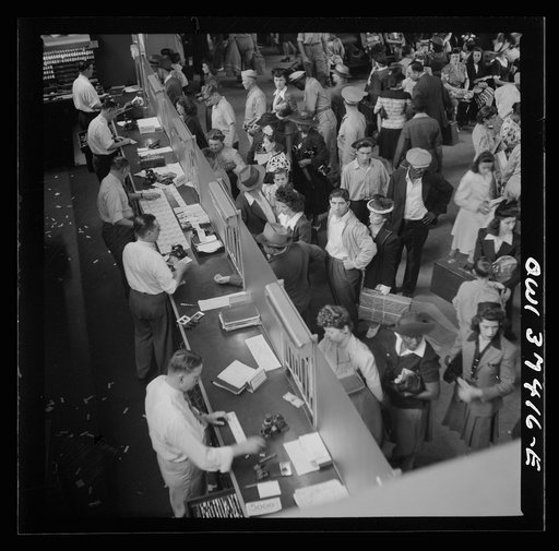 Pittsburgh, Pennsylvania. A crowd buying tickets at the Greyhound bus terminal