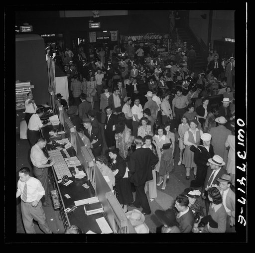 Pittsburgh, Pennsylvania. A crowd buying tickets at the Greyhound bus terminal