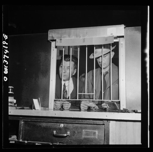 Pittsburgh, Pennsylvania. People buying tickets at the Greyhound bus terminal