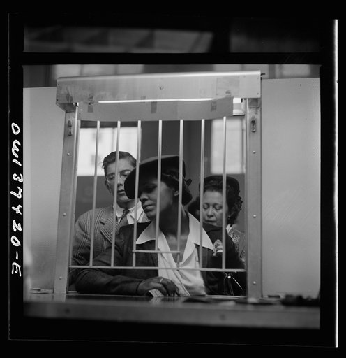 Untitled photo, possibly related to: Pittsburgh, Pennsylvania. People buying tickets at the Greyhound bus terminal