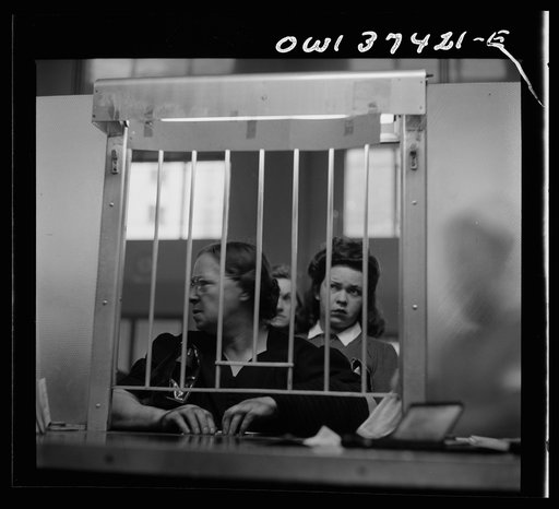 Untitled photo, possibly related to: Pittsburgh, Pennsylvania. People buying tickets at the Greyhound bus terminal