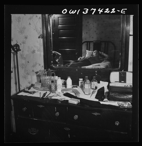 Untitled photo, possibly related to: Pittsburgh, Pennsylvania. Hotel room where Clem Carson, a Greyhound driver, lives and which he shares with another bus driver. They each pay six dollars a week