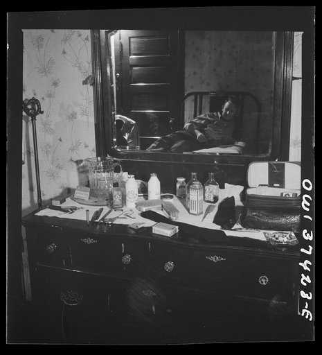 Untitled photo, possibly related to: Pittsburgh, Pennsylvania. Hotel room where Clem Carson, a Greyhound driver, lives and which he shares with another bus driver. They each pay six dollars a week