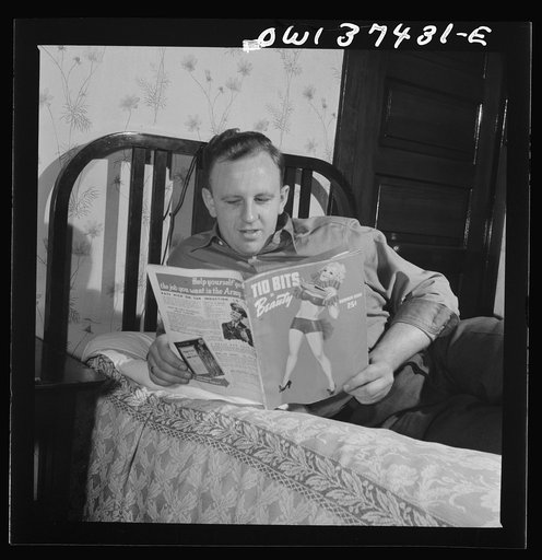 Pittsburgh, Pennsylvania. Clem Carson, a Greyhound bus driver, reading one of his favorite magazines. He and his roommate buy very few because so many are left on the buses. This one, however, was purchased