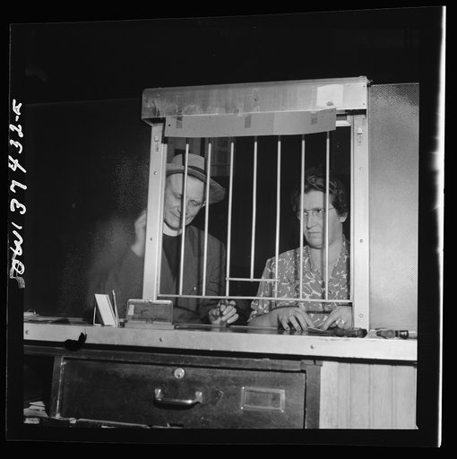 Pittsburgh, Pennsylvania. People buying tickets at the Greyhound bus terminal