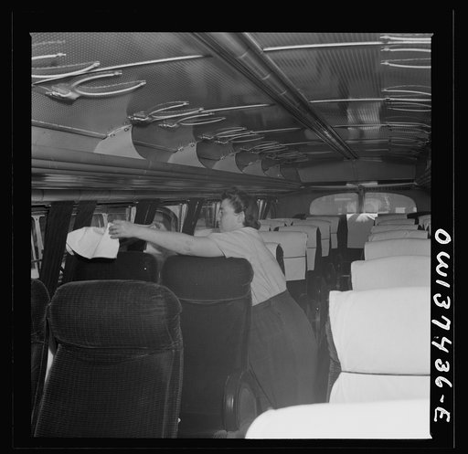 Untitled photo, possibly related to: Columbus, Ohio. A woman cleaner who is employed at the Greyhound garage to wash buses