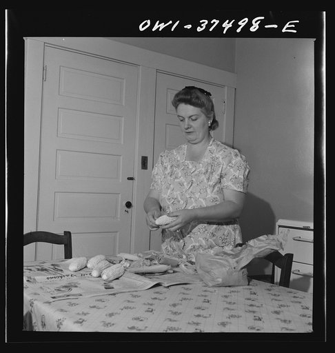 Cincinnati, Ohio. Mrs. Bernard Cochran, the wife of a Greyhound bus driver, preparing Sunday dinner at home