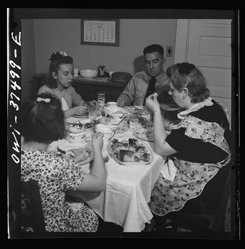 Cincinnati, Ohio. "Red" Cochran, a Greyhound bus driver and his family having Sunday dinner