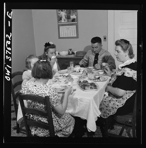 Cincinnati, Ohio. "Red" Cochran, a Greyhound bus driver, and his family eating Sunday dinner