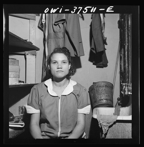 Cincinnati, Ohio. A maid in the women's restroom at the Greyhound bus terminal